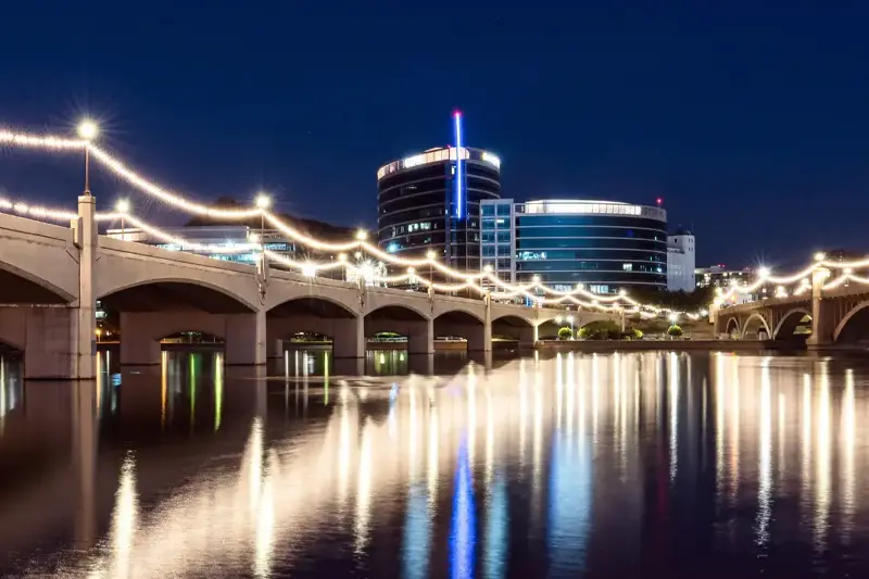 Stunning night view of Tempe, AZ bridge reflected in the water